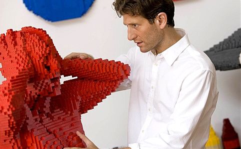 Nathan Sawaya and one of his Brick Men. Photo courtesy of ArtScience Museum.